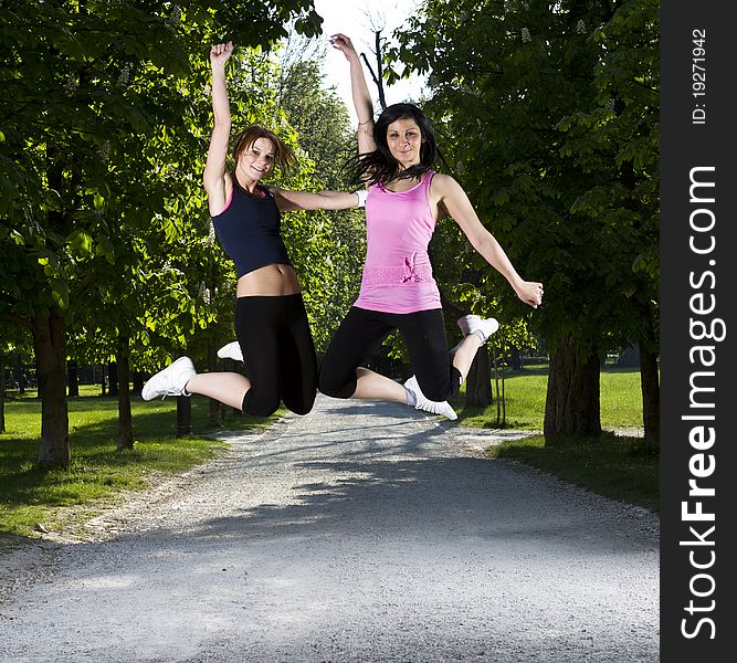 Young girls jogging running in the park. Young girls jogging running in the park