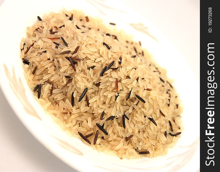 Wild rice and basmati rice isolated on white background. Wild rice and basmati rice isolated on white background