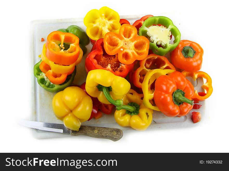 Cut colorful pepper slices on white background. Cut colorful pepper slices on white background