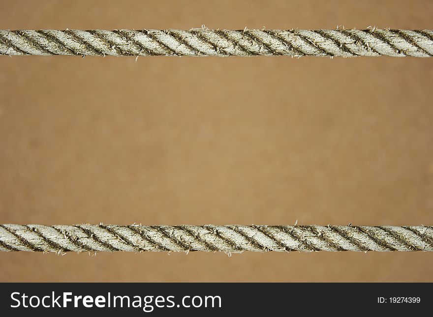 Rope on sand as background