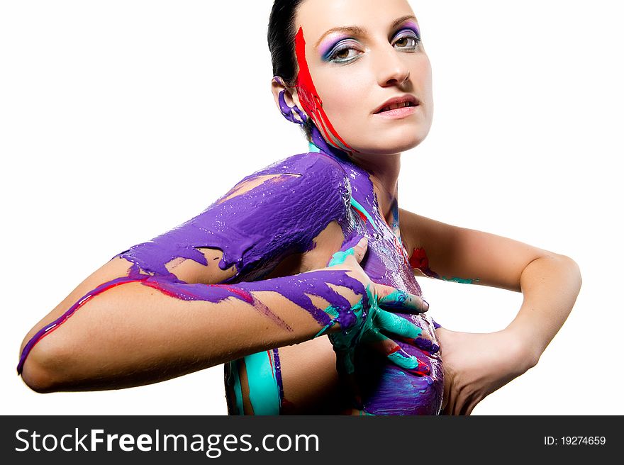 Brunette with colorful body painting over white background. Brunette with colorful body painting over white background
