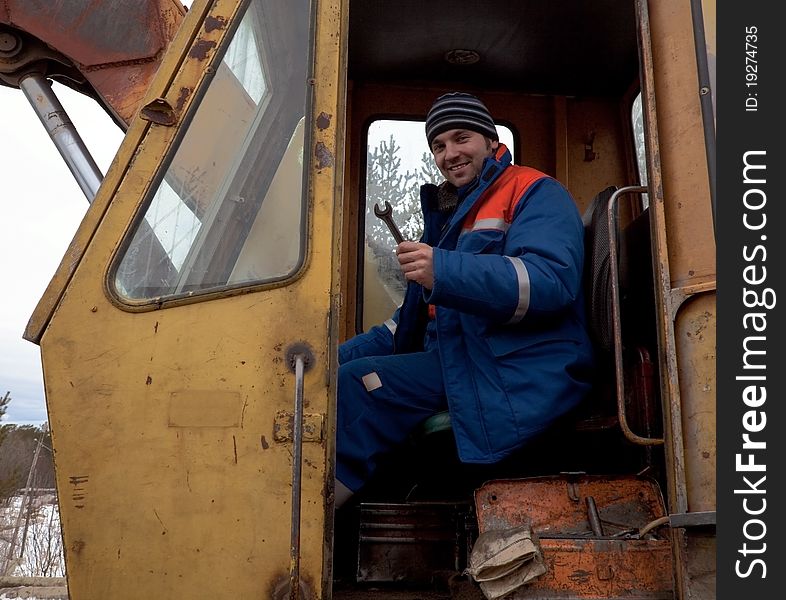 Machinist Excavator With A Wrench In His Hand