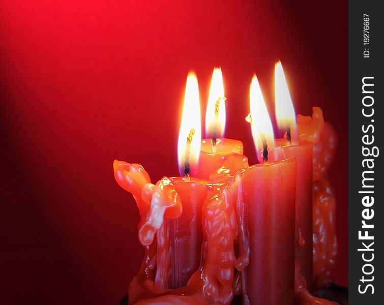 Burning Candles with Light Directed on Them