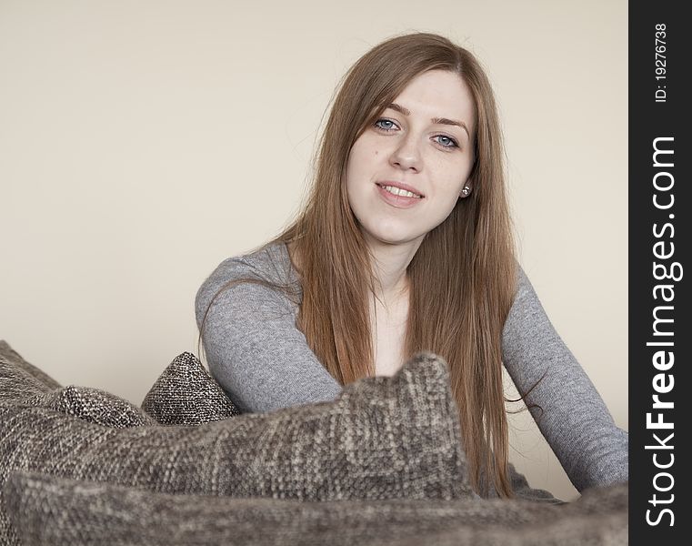 Beautiful young woman sitting on the bed. Beautiful young woman sitting on the bed