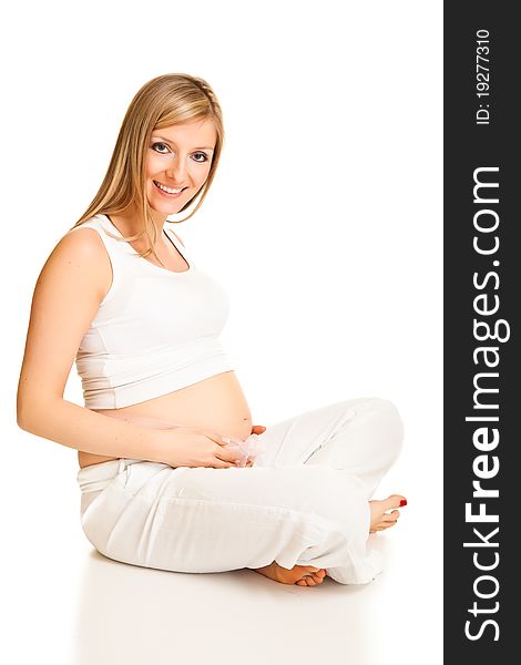 Pregnant blond woman isolated on white