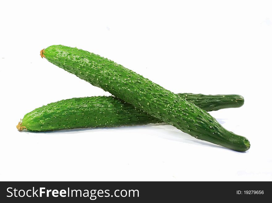 White background with two fresh cucumber.