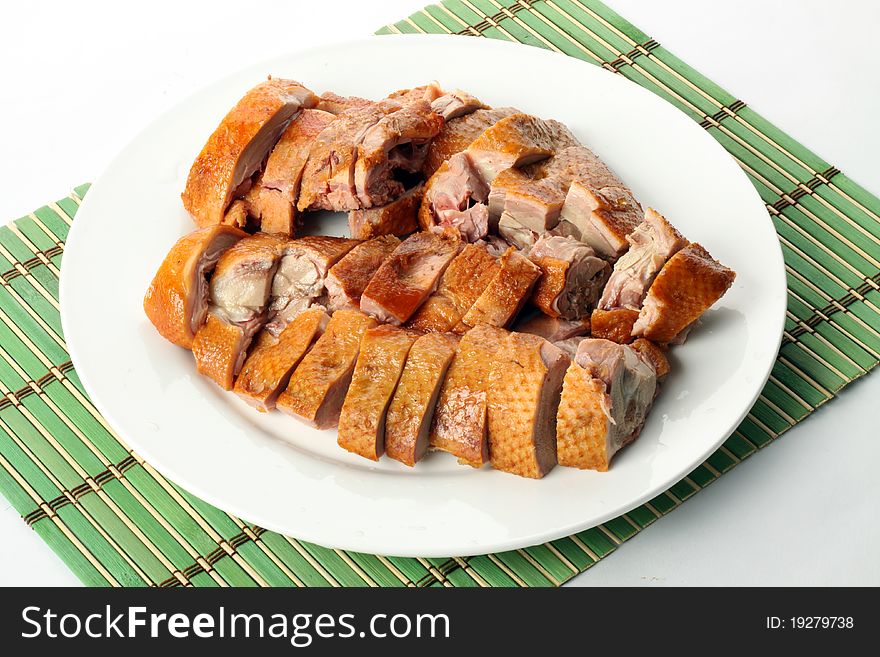 Delicious roast duck on a white background