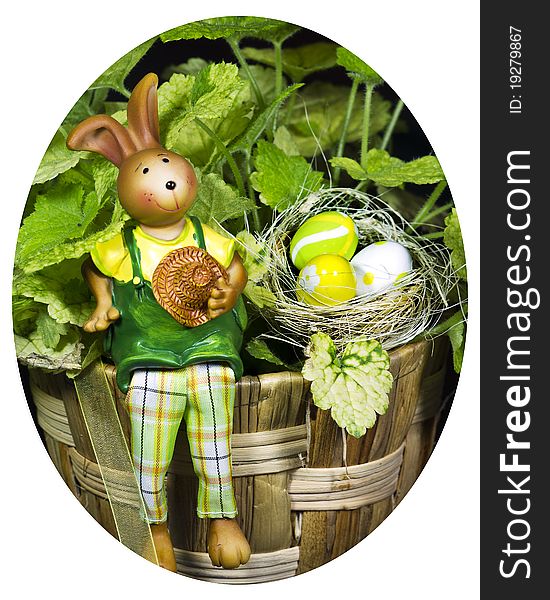 Bunny With Easter Eggs With A Plant In Backgroun