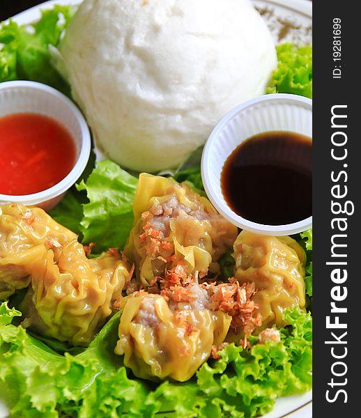 Chinese steamed dumplings and bun with sauce