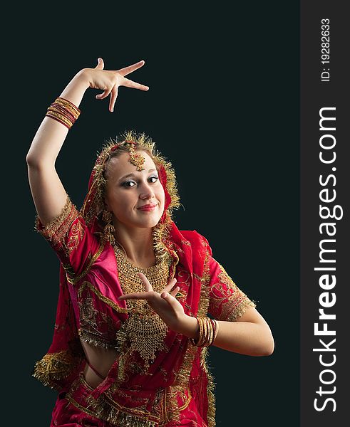 Young woman in red rich oriental  indian costume