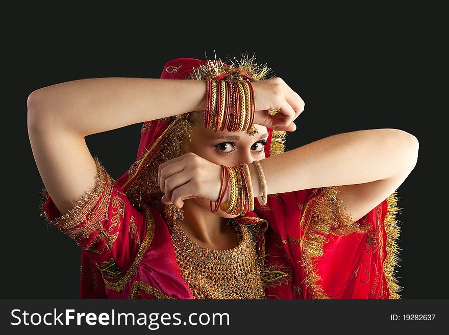 Young girl in red indian costume closeup portrait