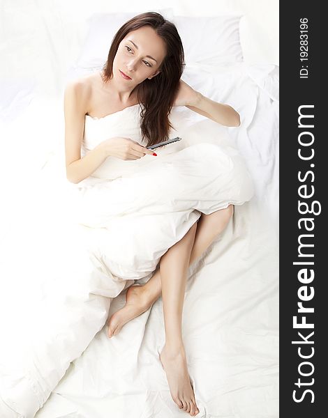 Portrait of a adult brunette in bed. Portrait of a adult brunette in bed