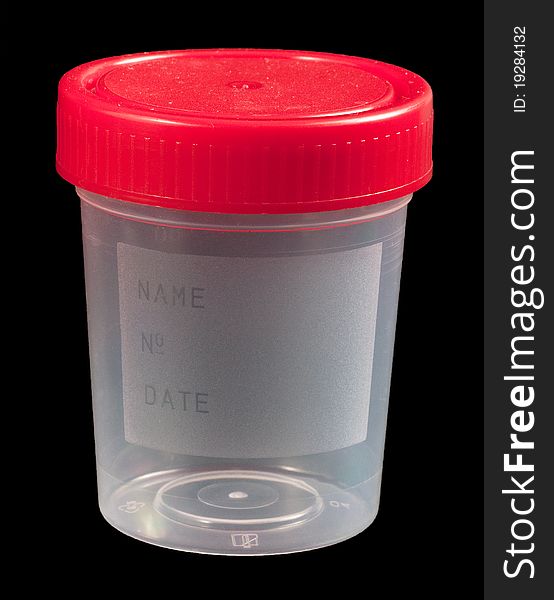 Empty urine sample container isolated on black