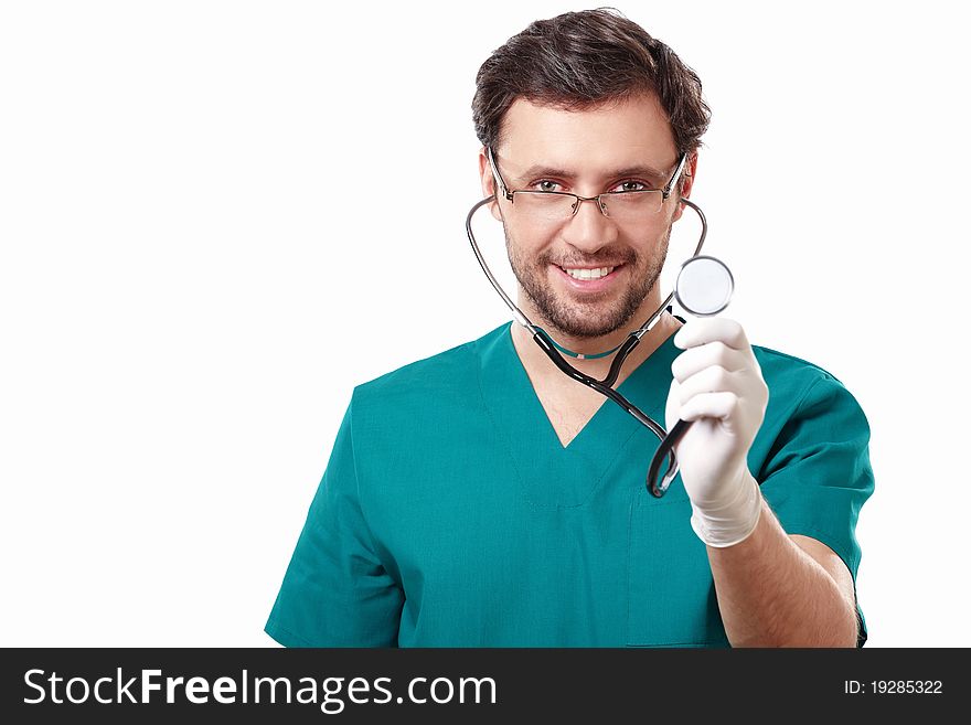 Attractive surgeon with a stethoscope on a white background. Attractive surgeon with a stethoscope on a white background