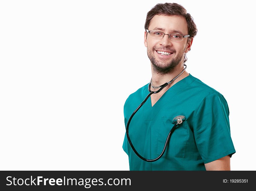 Attractive surgeon with a stethoscope on a white background. Attractive surgeon with a stethoscope on a white background