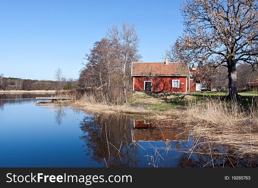 Swedish Red  House At A Lake.