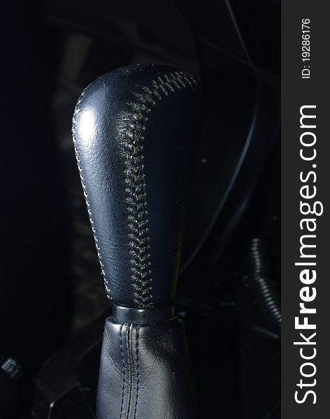 Black leather car gear stick. Black leather car gear stick