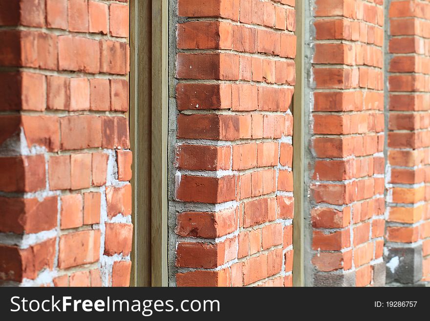 The red brick and white window