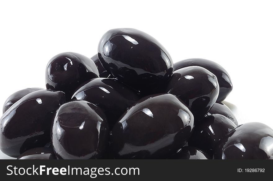A lot of olives closeup isolated on white background