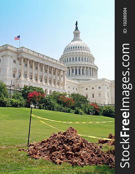 A beautiful day on Capitol Hill. The Congress building with an American flag flying. However, there is some construction going on. Are they fixing Washington? Could represent the sequester or sequestration. A beautiful day on Capitol Hill. The Congress building with an American flag flying. However, there is some construction going on. Are they fixing Washington? Could represent the sequester or sequestration.