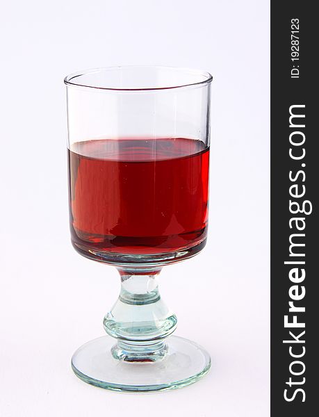 A single glass of red wine, isolated on white