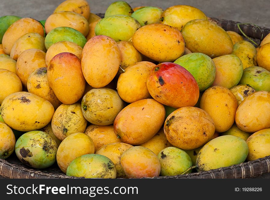Mangos on basket in the market. Mangos on basket in the market