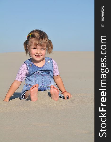 Cute little girl play in sand