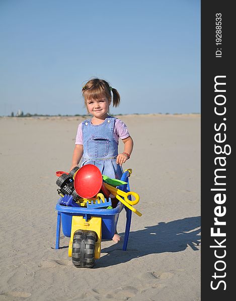 Cute little girl play in sand