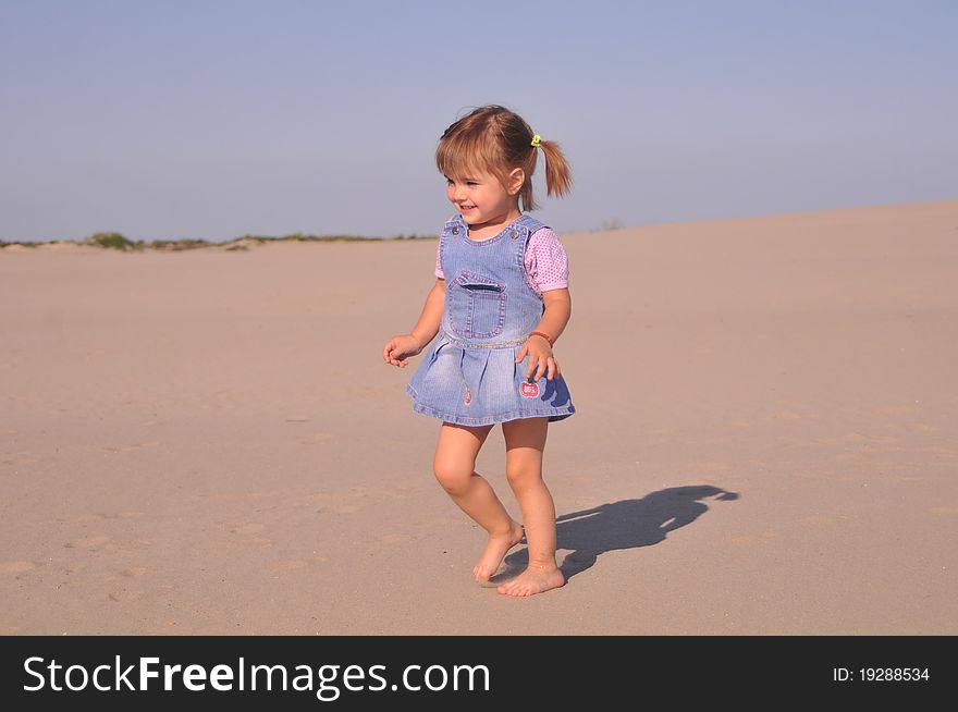 Cute little girl play in sand