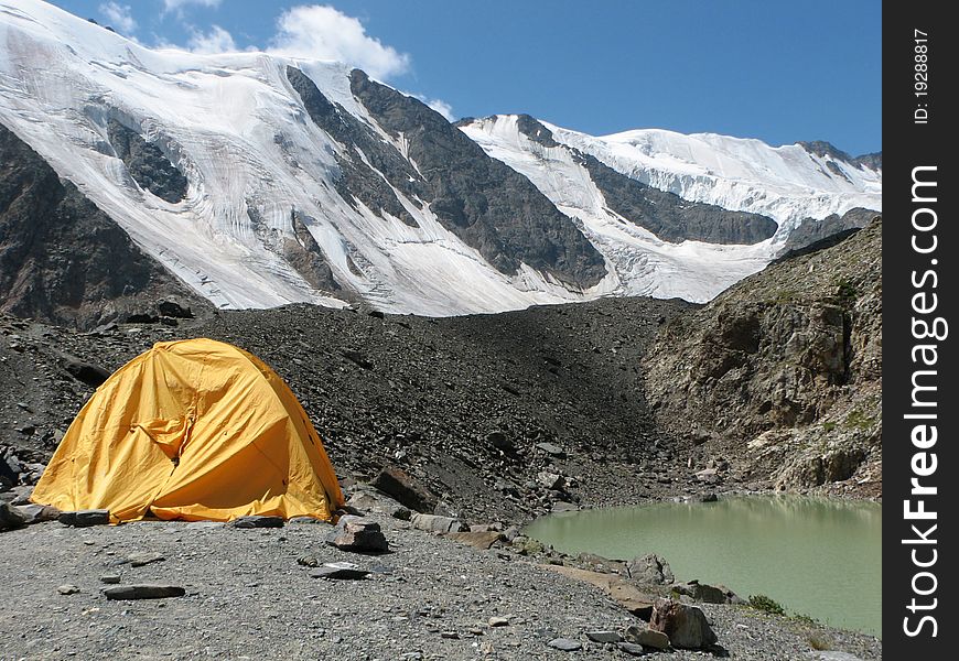 Landscape of Siberian highland with the cristall green lake. altitude is 3500 m. Landscape of Siberian highland with the cristall green lake. altitude is 3500 m