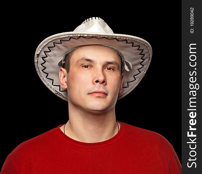 Man wearing a cowboy hat. Isolated on black background.