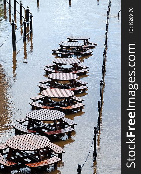 Flooded tables on riverside of York's River Ouse. Flooded tables on riverside of York's River Ouse.