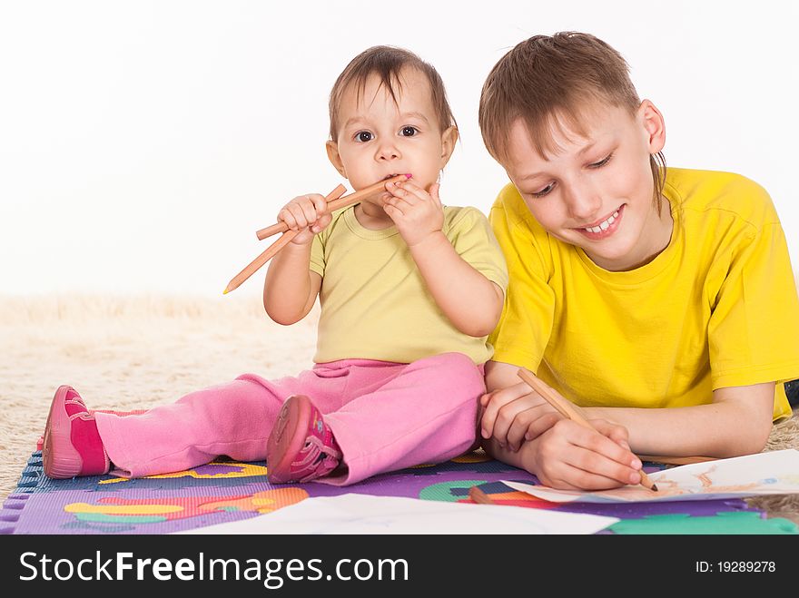 Brother and sister drawing and dreaming on white background