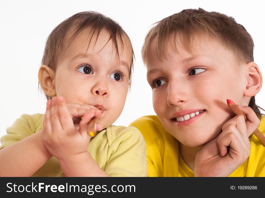 Happy brother and sister on a white background