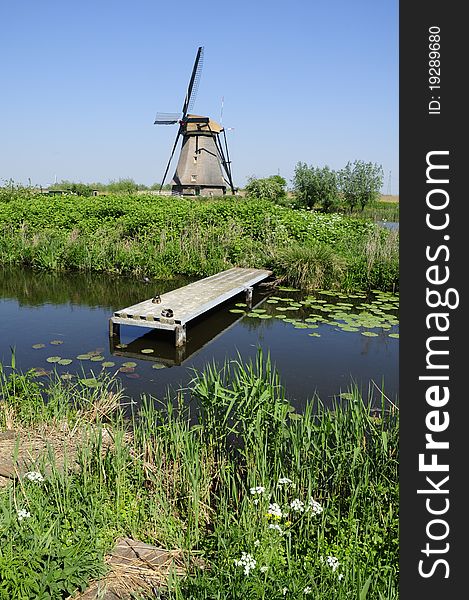 A windmill near Kinderdijk in the Netherlands. A windmill near Kinderdijk in the Netherlands