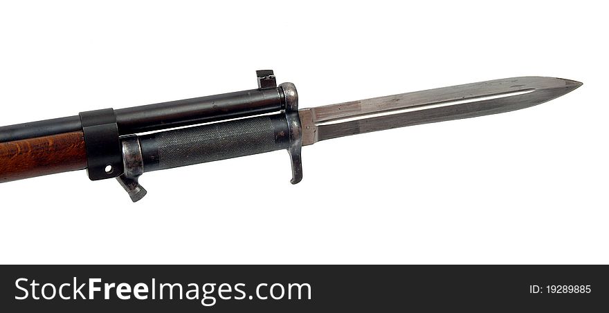 A bayonet fixed to a rifle. A bayonet fixed to a rifle.