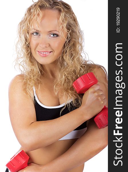 Cute athlete is posing with weights. Cute athlete is posing with weights