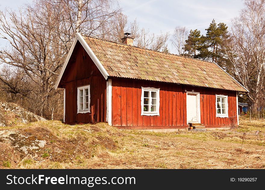 Typical old wooden, painted red and white, summer house in sweden. Typical old wooden, painted red and white, summer house in sweden.