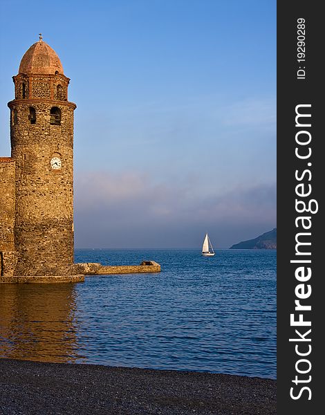 Stone clock tower marks the entrance to the sea port. Stone clock tower marks the entrance to the sea port