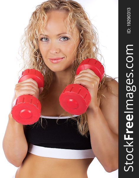 Mature sportswoman holding red weights. Mature sportswoman holding red weights