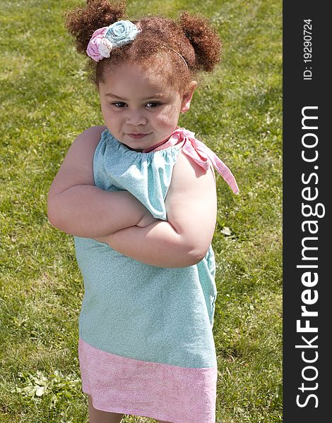 Young girl crossing her arms, acting very angry. Young girl crossing her arms, acting very angry.