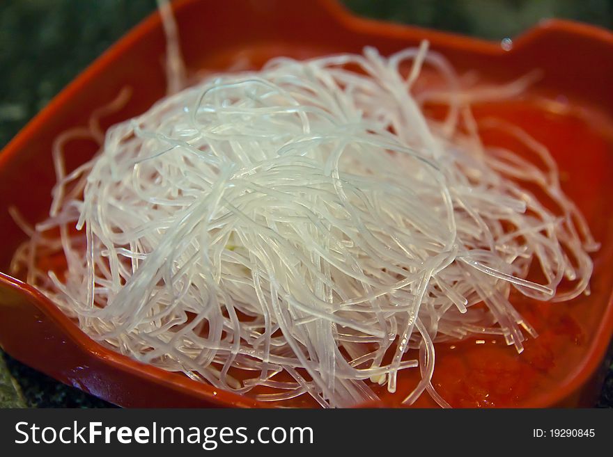 Raw Vermicelli On Red Plate