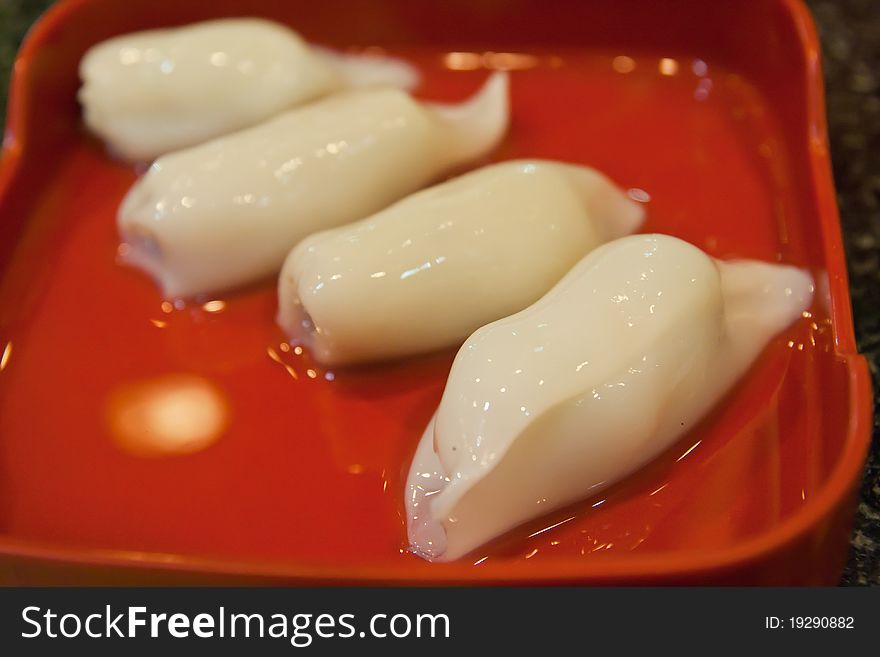 Raw squid stuffed with minced pork