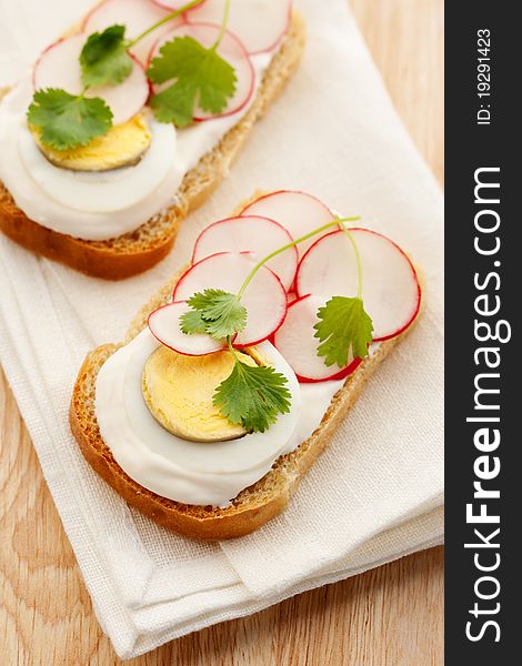 Healthy breakfast, sandwich with cream cheese, egg and radish