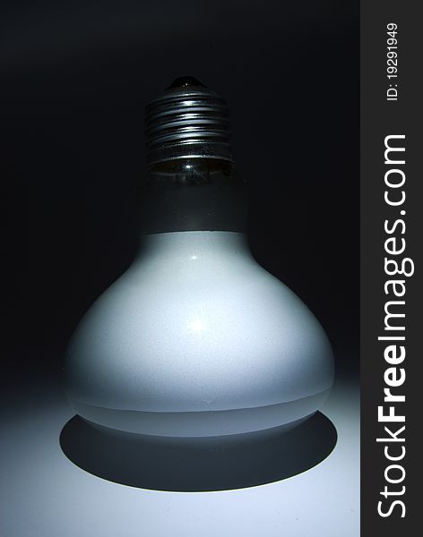 Matte white bulb illuminated in the dark