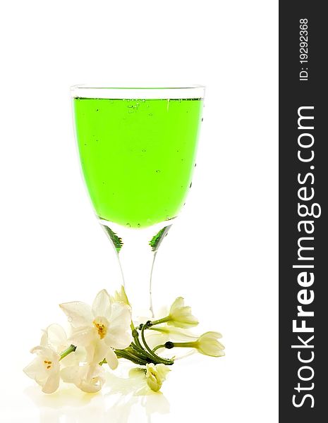 Lemonade of green color in a glass bottle on the white isolated background. Lemonade of green color in a glass bottle on the white isolated background