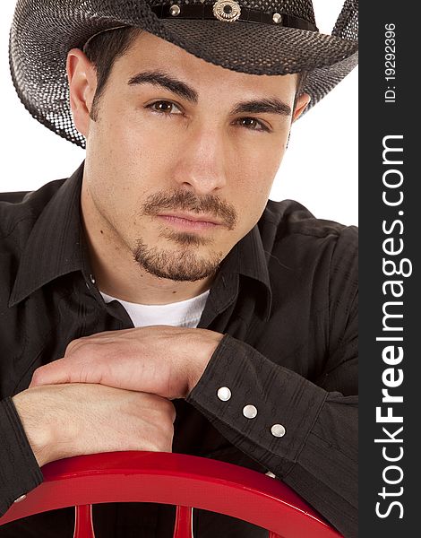 A cowboy with a serious expression on his face. A cowboy with a serious expression on his face.