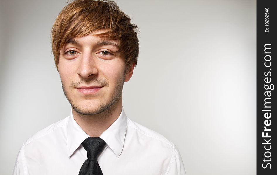 Young man is dressing up with tie. Young man is dressing up with tie