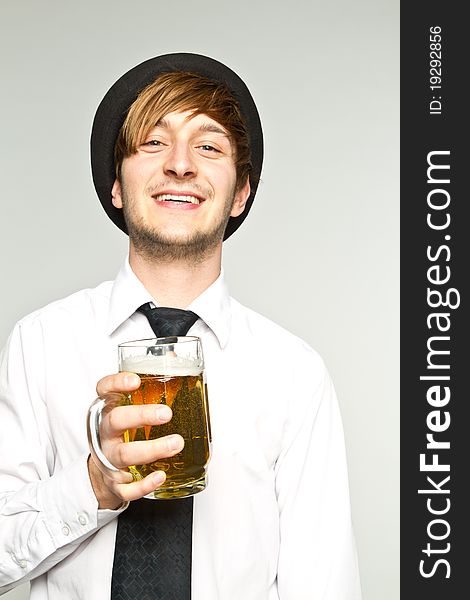Young man with glass of beer