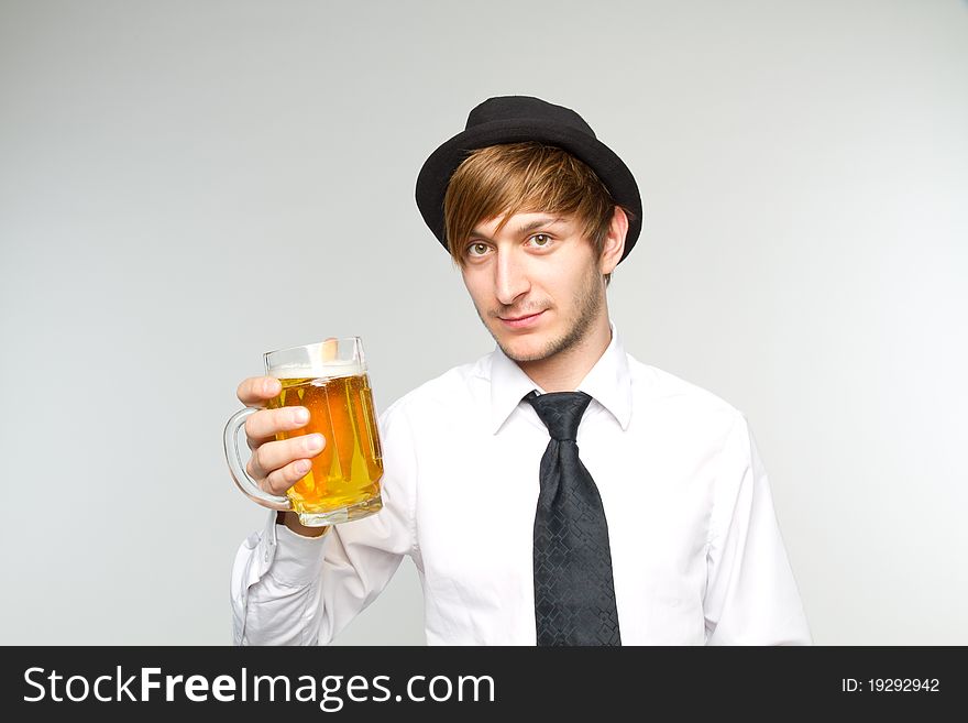 Young man with glass of beer